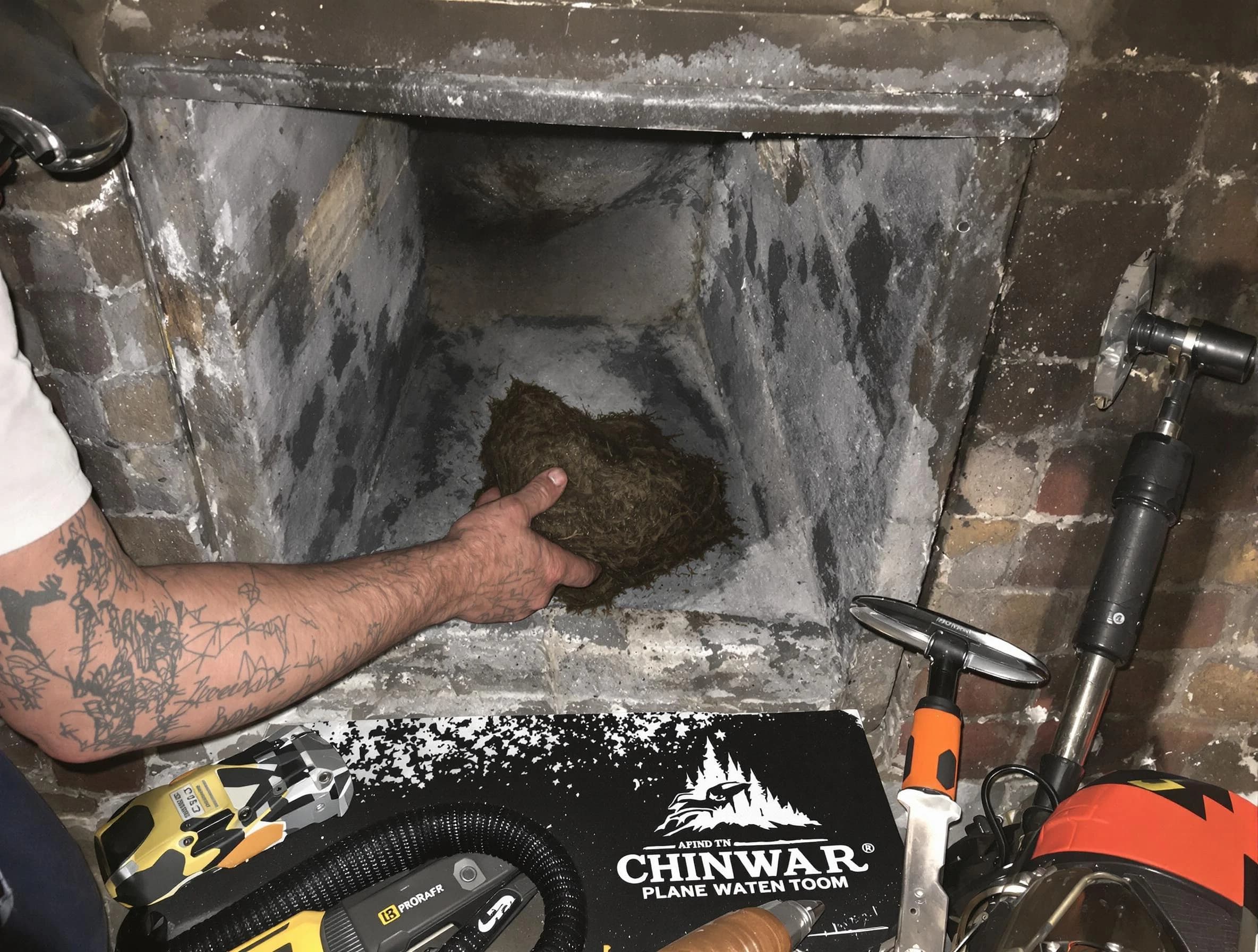 North Druid Hills Chimney Sweep safely removing debris and screening chimney in North Druid Hills, GA
